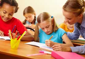 Tuition - girl writing at the centre in Godalming and Cranleigh